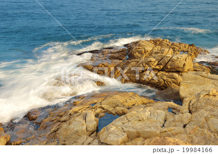 rocky sea coast and blurred water in shek o, 19984166