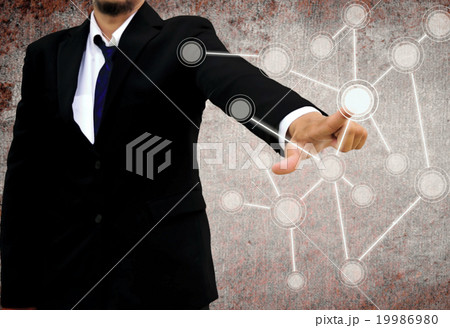 businessman pushing a touch screen interface 19986980