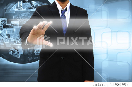businessman pushing a touch screen interface 19986995