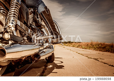 Biker girl riding on a motorcycle Biker girl riding on a motorcycle 19988698