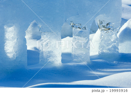Transparent columns of ice on the snow 19993916