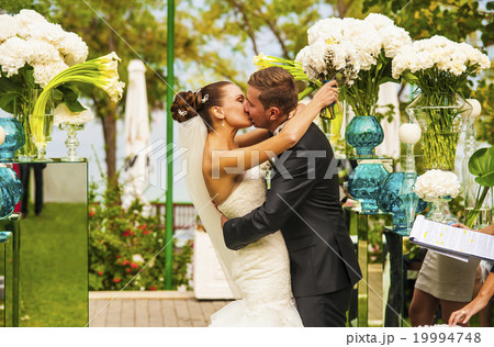 The newlyweds during wedding ceremony. 19994748