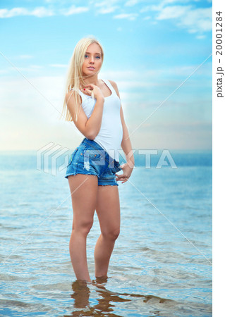 beautiful young blond woman in shorts beautiful young blond woman in shorts 20001284