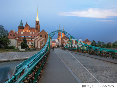 Wroclaw Tumski Island bridge, vivid sunset Wroclaw Tumski Island bridge, vivid sunset 20002475