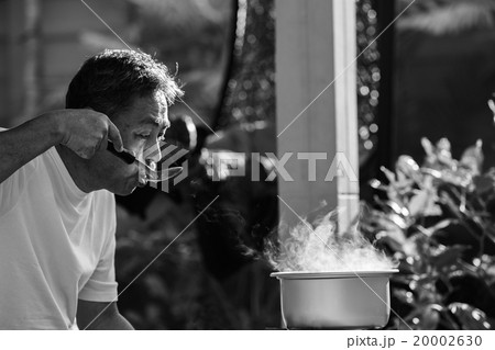 old man cooking morning food 20002630