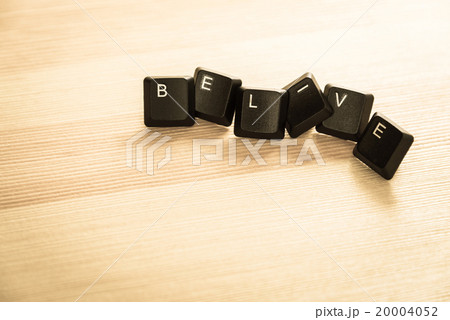 Belive word keyboard on wooden floor retro style 20004052
