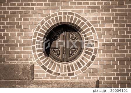 Circle window on the brick wall monochrome style 20004101