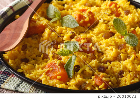 Sweet yellow rice with raisins and dried apricots Sweet yellow rice with raisins and dried apricots 20010073