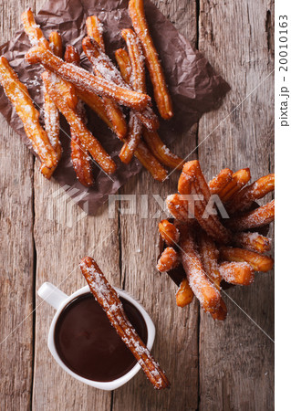 churros and hot chocolate close-up. top view churros and hot chocolate close-up. top view 20010163