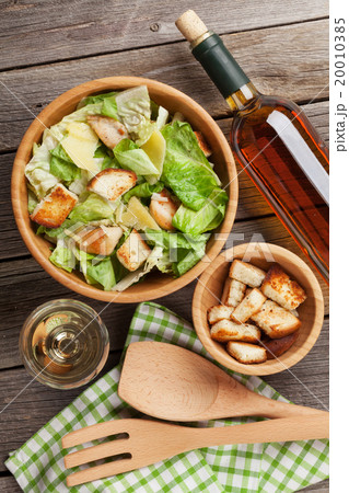 Fresh healthy caesar salad and white wine 20010385