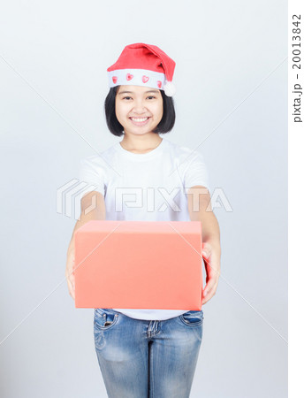 young attractive asian girl in Santa hat and red gift box 20013842