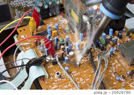 Soldering iron working on electronic boards Soldering iron working on electronic boards 20020790