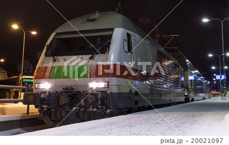 Modern passenger train on railway station at night Modern passenger train on railway station at night 20021097