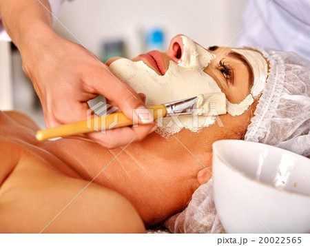 Woman middle-aged take face massage in spa salon. Woman middle-aged take face massage in spa salon. 20022565