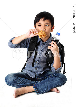 Kid eating Fried chicken Kid eating Fried chicken 20030345
