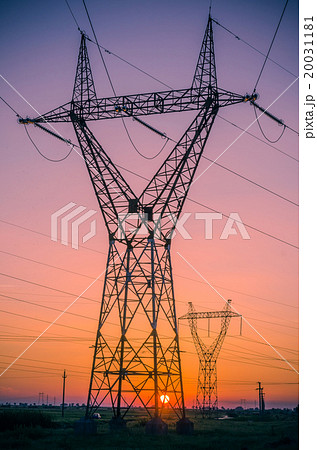 Silhouette electricity pylons during sunset 20031181