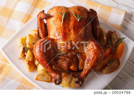 roast chicken with oranges, potatoes and apples roast chicken with oranges, potatoes and apples 20034766
