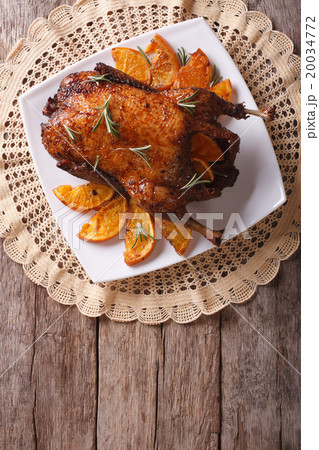 Delicious Roast duck with oranges on a plate Delicious Roast duck with oranges on a plate 20034772
