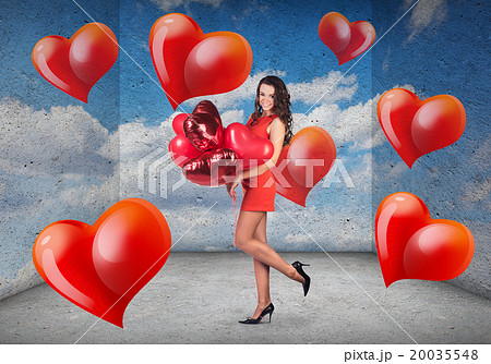 Woman with a heart-shaped balloons Woman with a heart-shaped balloons 20035548