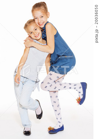 Two beautiful girls hugging Two beautiful girls hugging 20036050