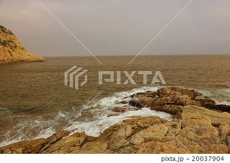 rocky sea coast and blurred water in shek o, 20037904