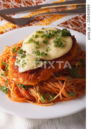 Italian chicken Parmigiana and pasta close up Italian chicken Parmigiana and pasta close up 20040994
