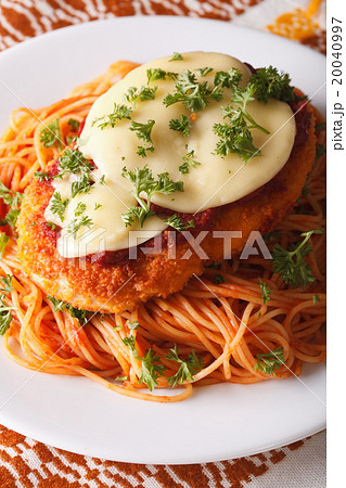 Chicken Parmigiana and pasta close-up on a plate 20040997