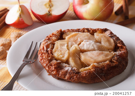 Dutch baby pancake with apples on a plate Dutch baby pancake with apples on a plate 20041257
