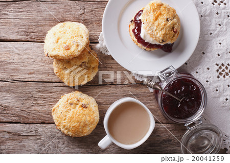 British scones with jam and tea close-up British scones with jam and tea close-up 20041259