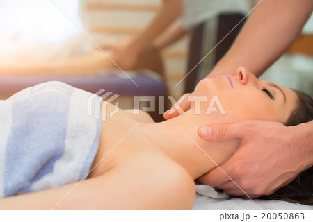 Therapist massaging the neck of woman Therapist massaging the neck of woman 20050863