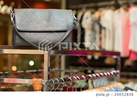 black bag on a shelf in the store 20052836