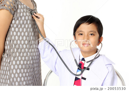 boy as doctor examining a girl boy as doctor examining a girl 20053530