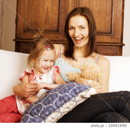 young happy mother with daughter at home 20061690