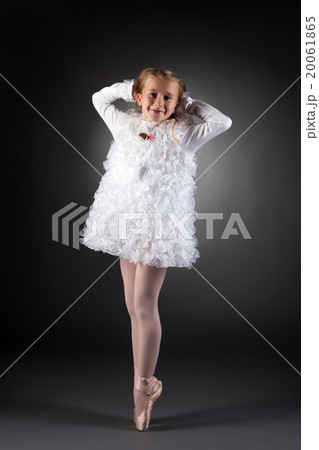 Little ballet dancer posing in white dress Little ballet dancer posing in white dress 20061865