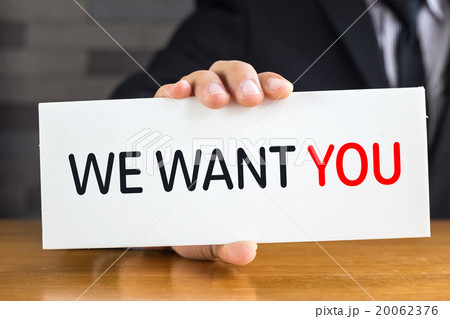 We want you, message on white card by businessman 20062376