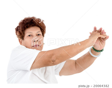 senior woman doing stretching exercise over white 20064382