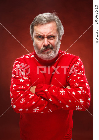 The expressive portrait on red background of a 20065510