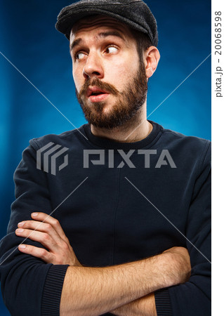 The young man's face with eyes looking sideway The young man's face with eyes looking sideway 20068598