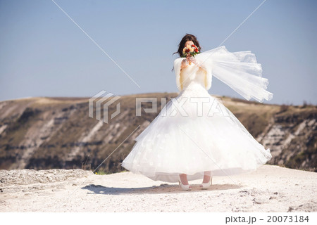 Beautiful bride with bouquet of flowers Beautiful bride with bouquet of flowers 20073184