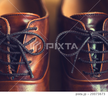 Close up of brown leather men's shoes. 20073673
