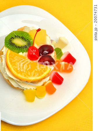 fruit cake with cream on white plate  20074731