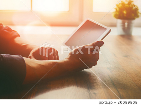 person looking to the digital tablet 20089808
