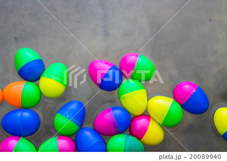 colorful of toy egg float on water in cement basin 20089940