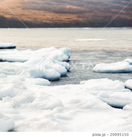 Natural sea ice blocks breaking up against shore.  20095150
