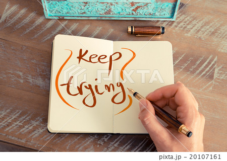 Handwritten text KEEP TRYING 20107161