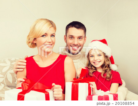 smiling family holding many gift boxes 20108854
