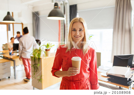 happy creative woman with coffee cup at office 20108908