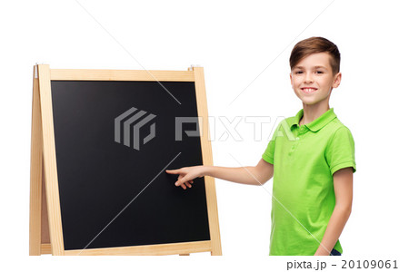happy boy with chalk and blank school blackboard happy boy with chalk and blank school blackboard 20109061