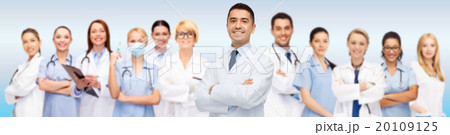 group of smiling doctors with clipboard 20109125