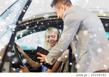 happy woman with car dealer in auto show or salon 20109193